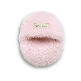 An oval fuzzy pink hand warmer with a pocket.