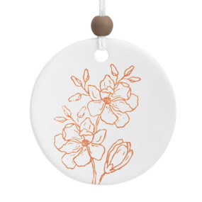 A round white ceramic hanging diffuser with line drawn orange flowers.