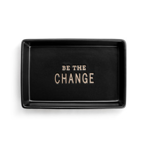 A black ceramic rectangular tray that says "Be The Change" inside.