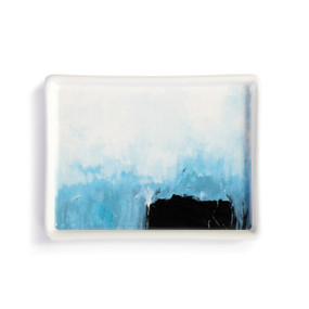 A white ceramic mini tray with artwork created by ArtLifting artist Charlie French. The image is of darker blues at the bottom gradually lightening as it moves up the tray.