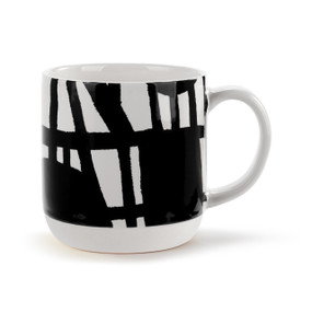 A white ceramic mug with artwork created by ArtLifting artist Linda King of a black and white pattern.