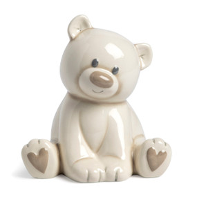 A cream ceramic sitting teddy bear bank with a brown nose and brown hearts on its paws.