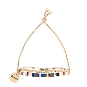 A gold chain adjustable bracelet with beads and tiles in brown blue and white. The bracelet also has a gold round charm that says Family.