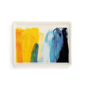 A white ceramic mini tray with artwork created by ArtLifting artist Charlie French. The image is vertical shades of yellow and blue paint stripes.