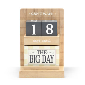 A wood countdown calendar that says "Can't Wait" and "days until". The top shelf has dark gray number blocks and the bottom shelf has different blocks that say what the countdown is for.