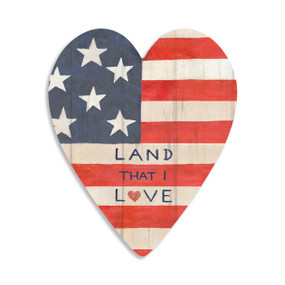 A heart shaped 100 piece puzzle with an image of the American flag that says "Land That I Love".