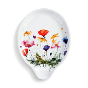 A white ceramic spoon rest with a watercolor image of wildflowers.
