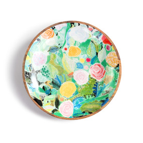 A small wood bowl with a colorful floral pattern on a black background created by ArtLifting artist Alicia Sterling Beach.