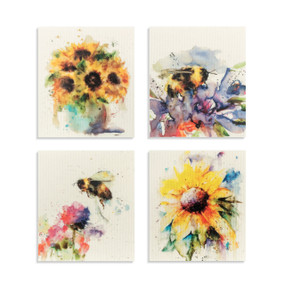 A set of four biodegradable reusable dish cloths with sunflowers on two and bees on the other two.