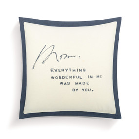A square cream and blue pillow with a message to Mom printed in the center.