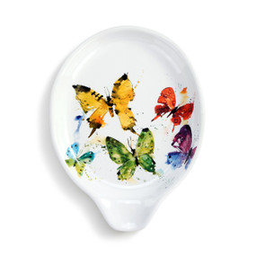 A white ceramic spoon rest with a watercolor image of colorful butterflies.