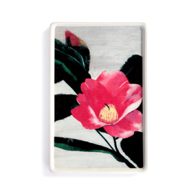 A white ceramic small tray with artwork created by ArtLifting artist Midori. The image is a pink camellia flower.