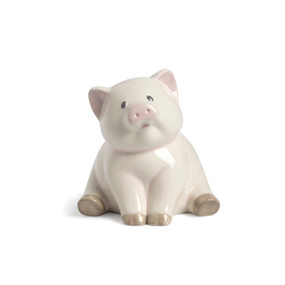 A cream ceramic sitting pig bank with pink ears and nose.