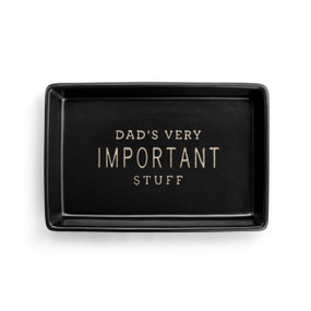A black ceramic rectangular tray that says "Dad's Very Important Stuff" inside.