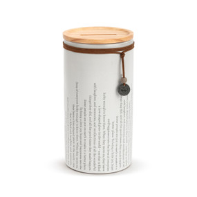 A white round ceramic container that has a sentimental remembrance message around the outside. The container has a wood lid with an open slot and a leather cord around the jar with a metal token that says "always".