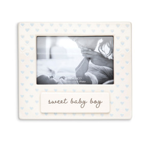 A cream ceramic photo frame with blue hearts and a ceramic tag that says "sweet baby boy".