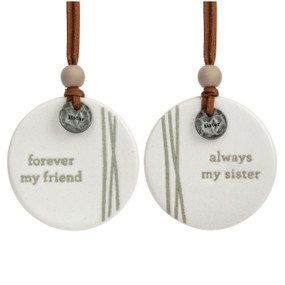 A set of two white hanging round ceramic ornaments with metal tokens that say "daughter" and "mother". One ornament says "love you forever" and the other says "love you always".