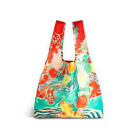 A fabric handled tote bag with artwork inspired by ArtLifting artist Alicia Sterling Beach of a floral pattern on a red background.