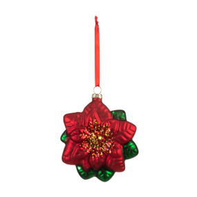 Blown glass ornament of a red poinsettia hanging from a red ribbon.