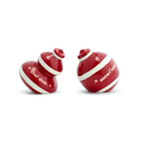 A set of two salt and pepper shakers with white stripes and shaped like Christmas ornaments. One is labeled "coal dust" and the other "snowflakes".
