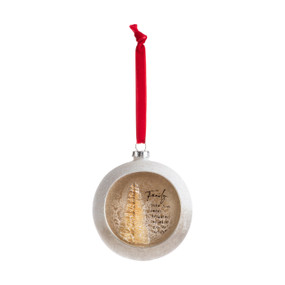 A silver ball ornament on a red ribbon with an opening at the front with a gold tree inside and a sentimental message about family.