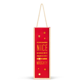 A red lit wood holiday lantern that says "Mostly Nice With A Chance of Naughty" with a rope handle at the top.