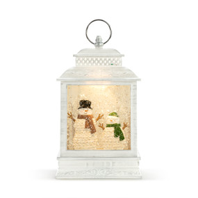 White lit lantern with two snowmen wearing scarves and hats inside.
