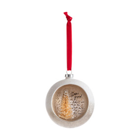 A silver ball ornament on a red ribbon with an opening at the front with a gold tree inside and a sentimental message for a friend.