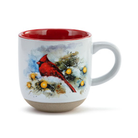 White ceramic mug with a textured base and red interior. The mug has a watercolor image of a cardinal in a snowy scene.