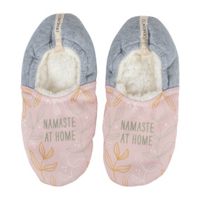 A pair of light pink and gray small sized slippers that say "Namaste At Home".