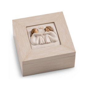 Cream wood box with hinged lid. Inset bas-relief plaque of two seated girls, facing each other.