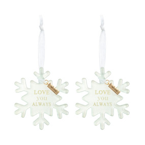 Set of two white snowflake shaped ornaments that say "Love you Always" and have a metal tag that says "Me + You".