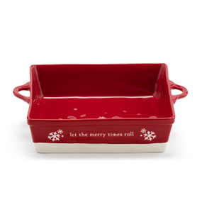 A square red ceramic dish with side handles that says "let the merry times roll" with a white base.