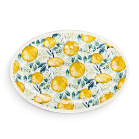 Top down view of a large oval melamine platter with a lemon patter on the top.