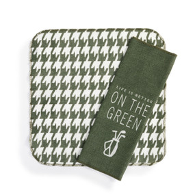 Two square thin cotton towels in green and white. One has a houndstooth pattern and the other is green and says "Life is Better On The Green".