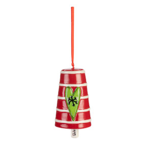 A red ceramic bell with white horizontal stripes and a raised green heart on the front.