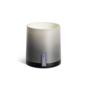 A Lavender + White Sage poured tester candle in an ombre gray glass vessel.