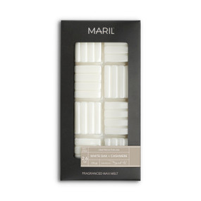 A set of White Oak + Cashmere white wax melts in a dark gray packaging box.