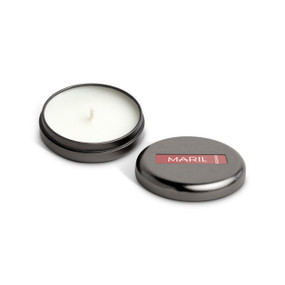 A small round dark metal tin with a white candle displayed with the lid off to the side. The candle has a Pink Pomelo + Aloe scent.