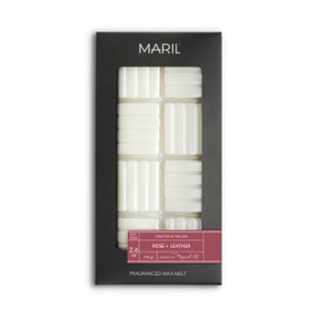 A set of Rose + Leather white wax melts in a dark gray packaging box.