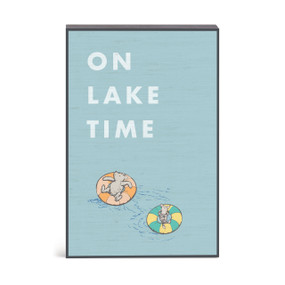 A blue wall art with an illustration of Pooh and Piglet on floats in the water and the saying "On lake time".