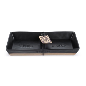 A black ceramic divided dish with a brown textured base and says "Dig In" in the side, displayed with a product tag attached.