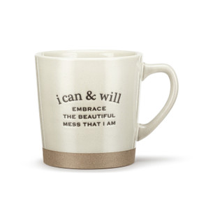 A cream stoneware mug with a brown textured base. The mug says "i can & will Embrace The Beautiful Mess That I Am".