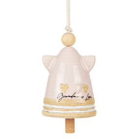A small cream ceramic angel shaped bell with small wings and a wood bead for the head. There are hearts at the base and the saying "Grandma is Love".