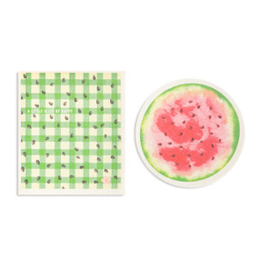 Two red and green biodegradable dish cloths. One is round and looks like a sliced watermelon and the other is green plaid with watermelon seeds and the saying "A little slice of happy".