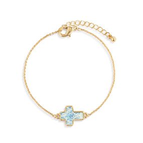 A gold chain adjustable bracelet with a cross shaped charm illustrated with blue and white and has the word "Hope" on the back.