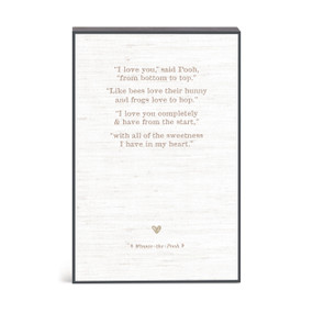 A Winnie-the-Pooh inspired wall art with a message about love.