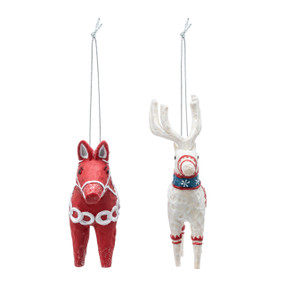 A red horse and white deer carved ornaments decorated in Scandi style.