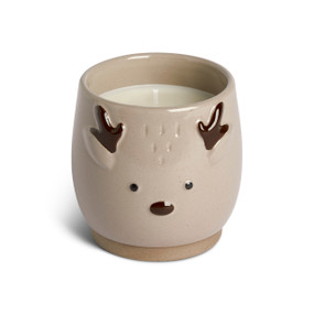 A light brown round ceramic filled candle with the face and antlers of a reindeer.