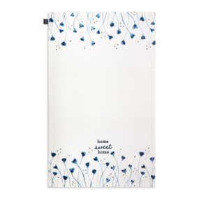 A white kitchen towel with illustrations of blue flowers and the saying "home sweet home" displayed with the towel laid out flat.